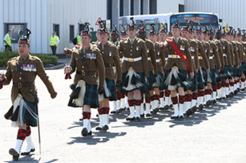 The 4SCOTS march at FirstGroup headquarters.